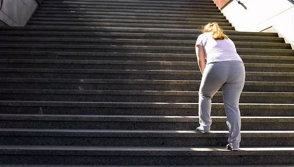Type-2-Inflammation-Asthma-and-Connected-Diseases-1-jpg A photo of a person struggling to walk up steps