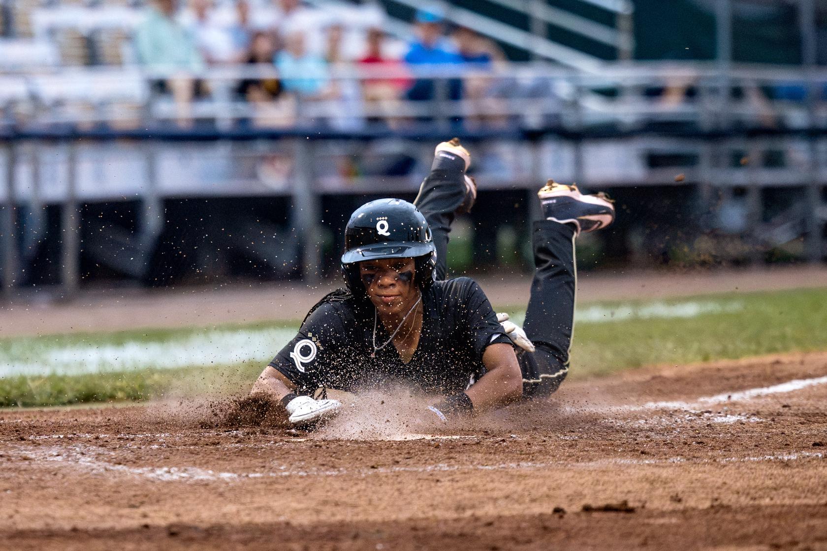 TDP-Z-EY-WPBL-5 Former Little League World Series star Mo'ne Davis slides into home for the Los Angeles Queens during a Women's Pro Baseball League at Robin Roberts Stadium in Springfield, Illinois. (Courtesy of Holly Desautels/Women's Pro Baseball League)