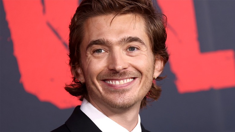 Austin Abrams smiling at the world premiere of 