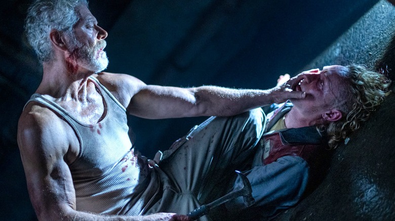 Stephen Lang grabs Adam Young in "Don't Breathe 2"